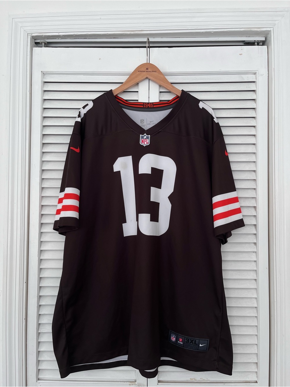 NFL Black Jersey with White 13 and Red Sleeve Stripes